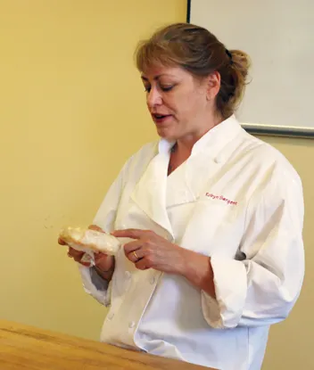 Robyn holds pie crust and explains butter speckles in pie crust. Taken at King Arthur Flour's Baking Education Center.