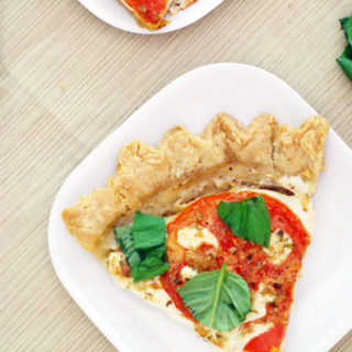 Savory Tomato Pie with tomatoes, basil, and mozzarella. The pie crust is homemade.