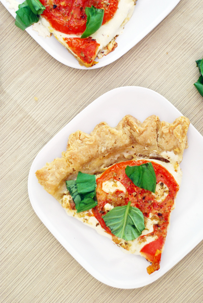 Savory Tomato Pie with tomatoes, basil, and mozzarella. The pie crust is homemade.